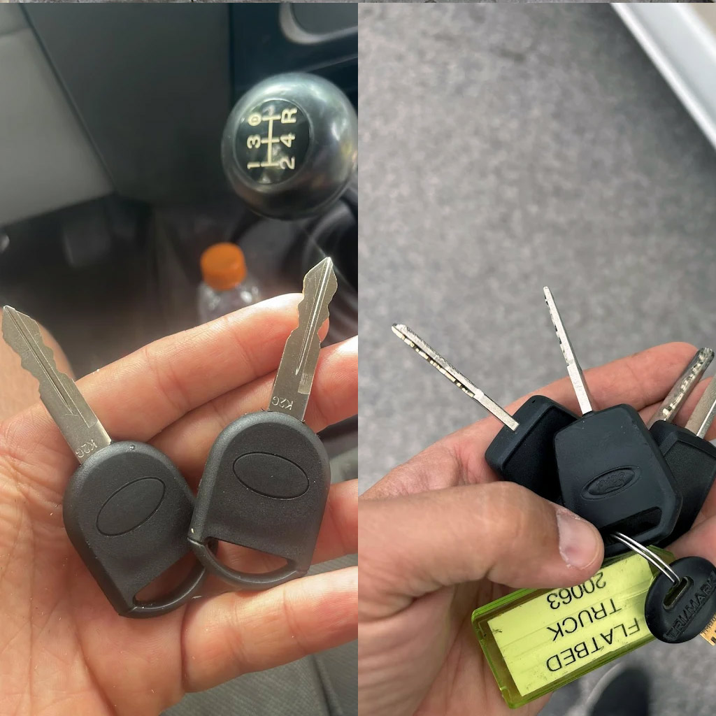 Replacement car keys held beside original Ford keys