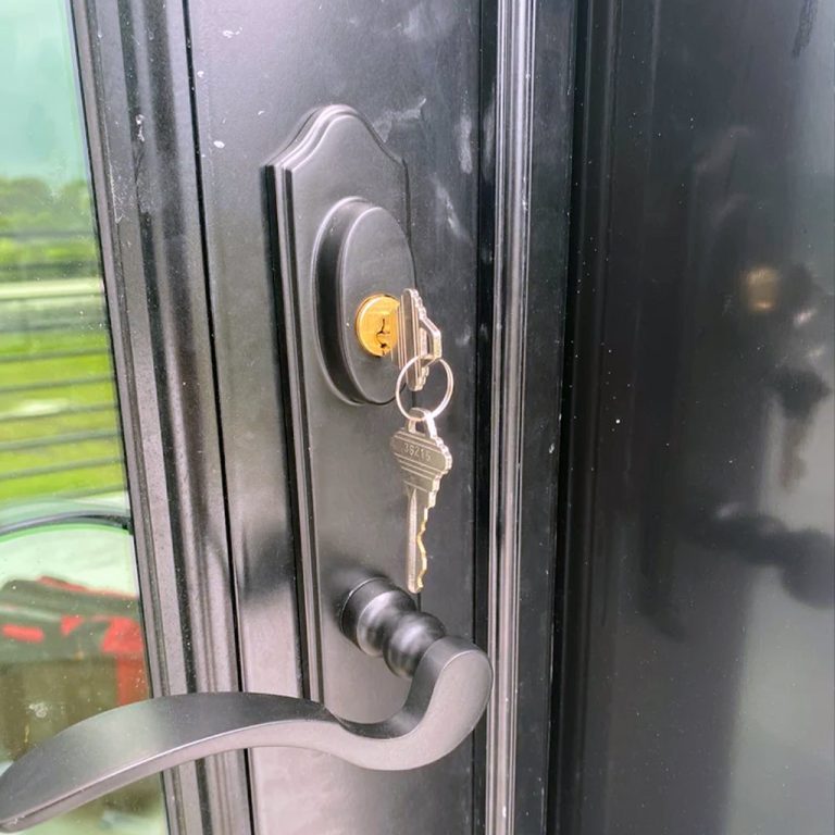 Newly rekeyed residential door lock with a fresh key inserted in Panama City Beach, FL